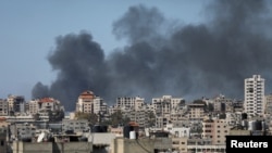 Smoke rises during an Israeli raid in Gaza City